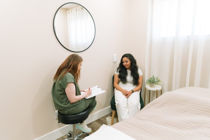 Client reviewing mapped AM and PM acne home care plan with provider in West Puyallup